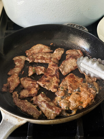 bulgogi cooking in cast iron skillet