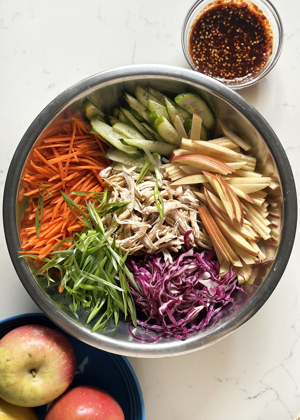 korean spicy chicken salad ingredients in mixing bowl