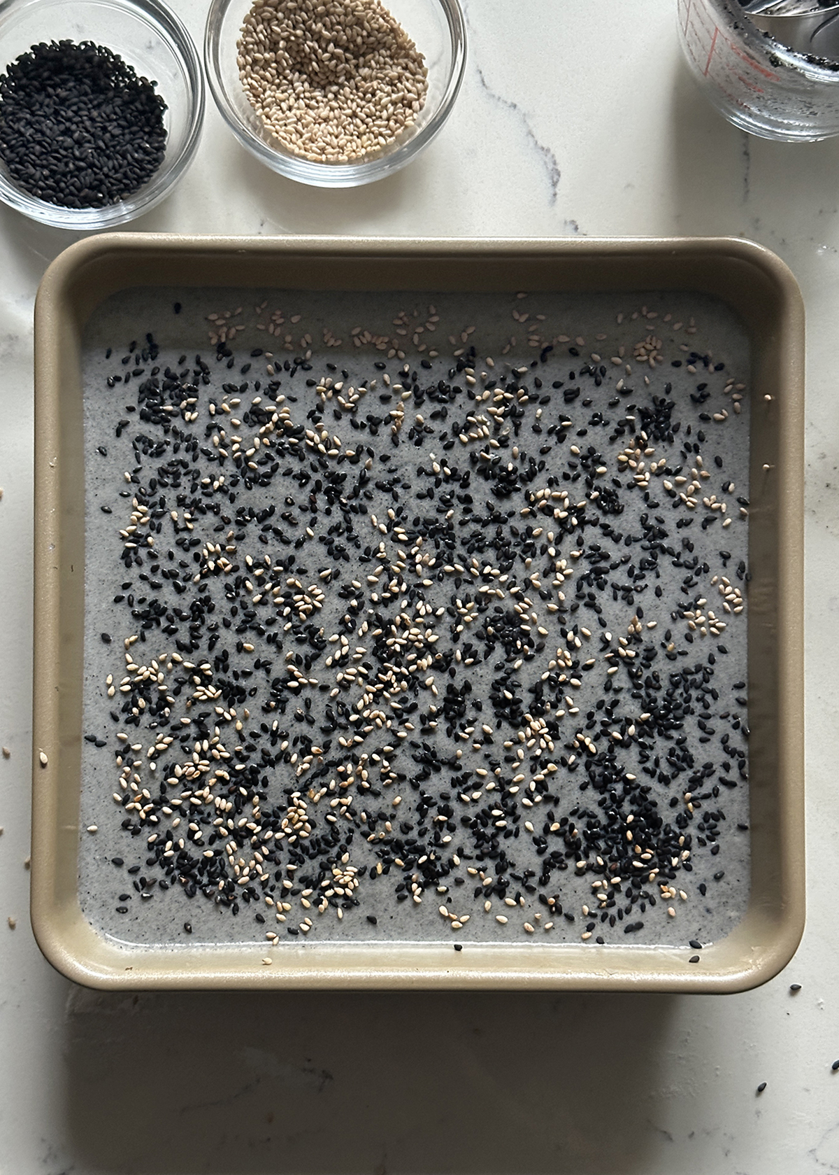 black sesame mochi cake batter: sesame sprinkles
