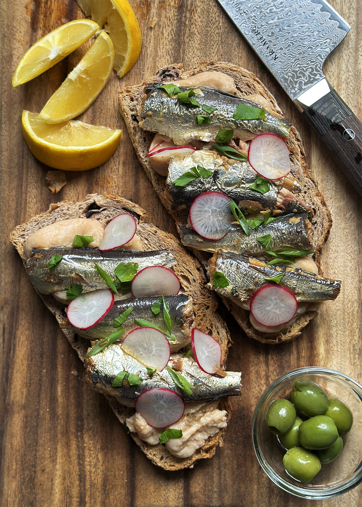 white bean hummus toast with sardines