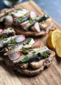 white bean hummus on toast with sardines
