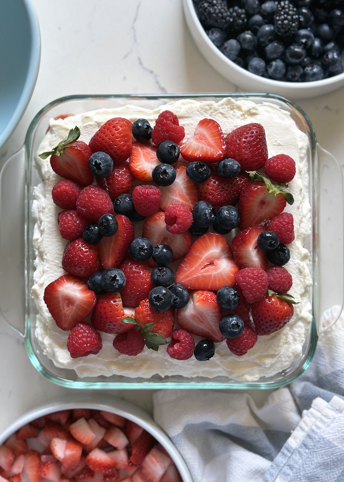 berry tiramisu with fresh berries on top