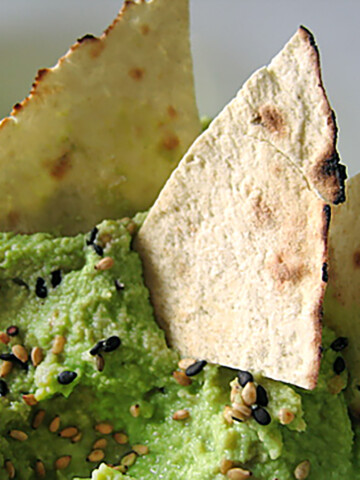 edamame hummus in bowl with chips