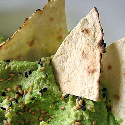 edamame hummus in bowl with chips
