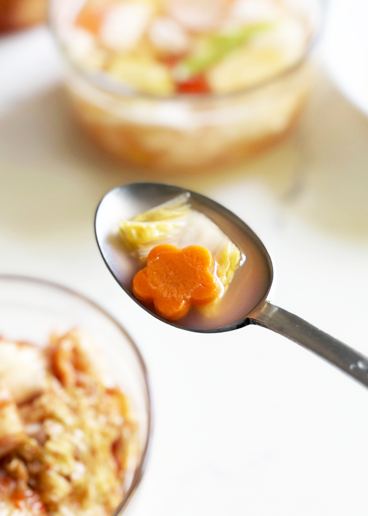 water kimchi in spoon