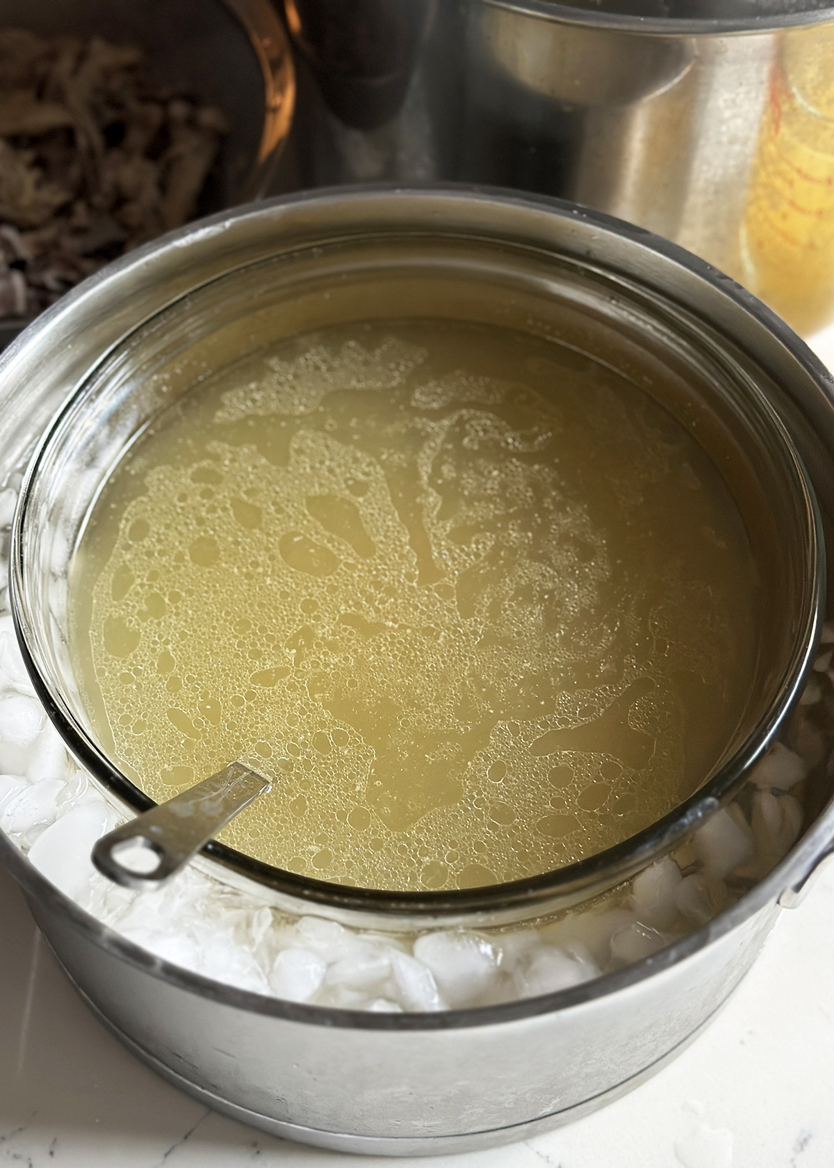 chicken bone broth in ice bath