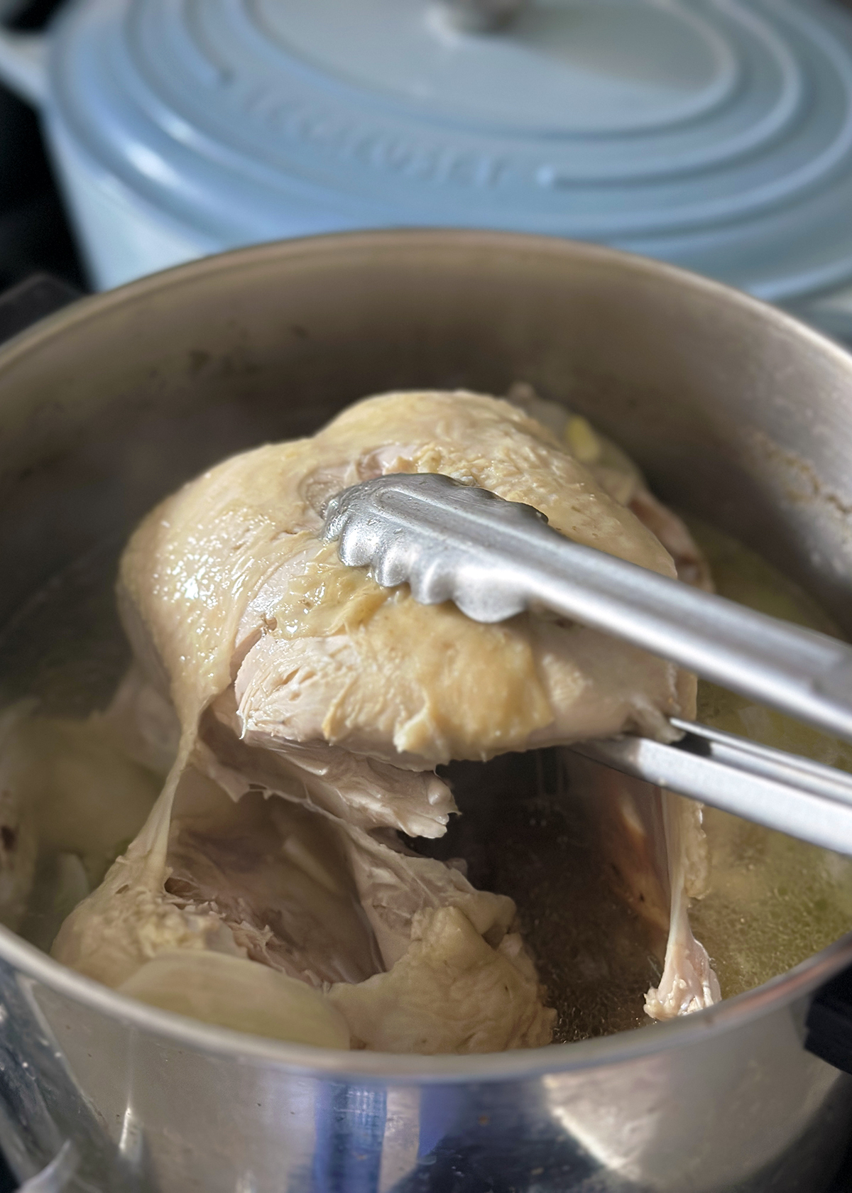 cooked whole chicken in pot