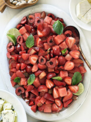 summer red fruit salad with cherries and strawberries