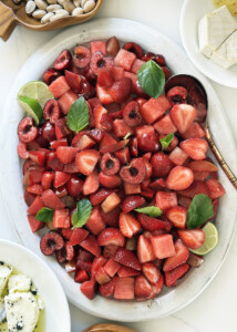 summer red fruit salad with cherries and strawberries