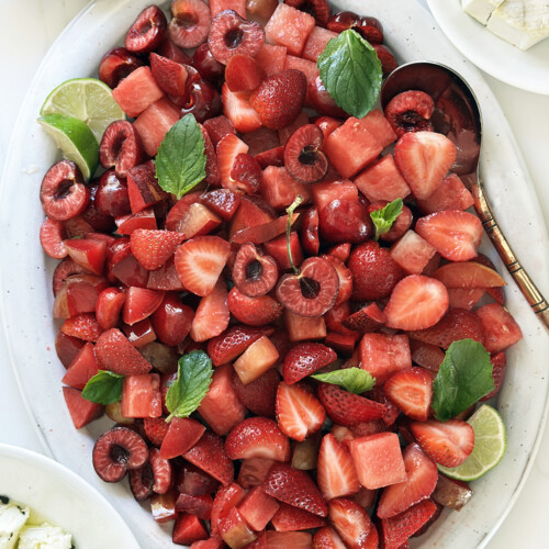 summer red fruit salad with cherries and strawberries