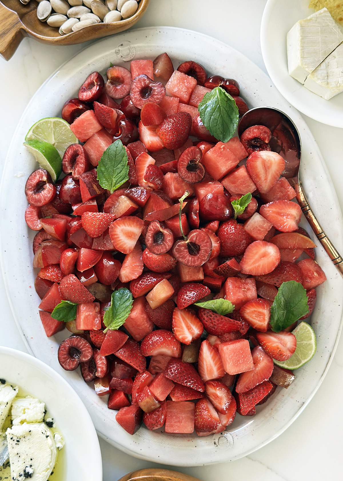 summer red fruit salad with cherries and strawberries