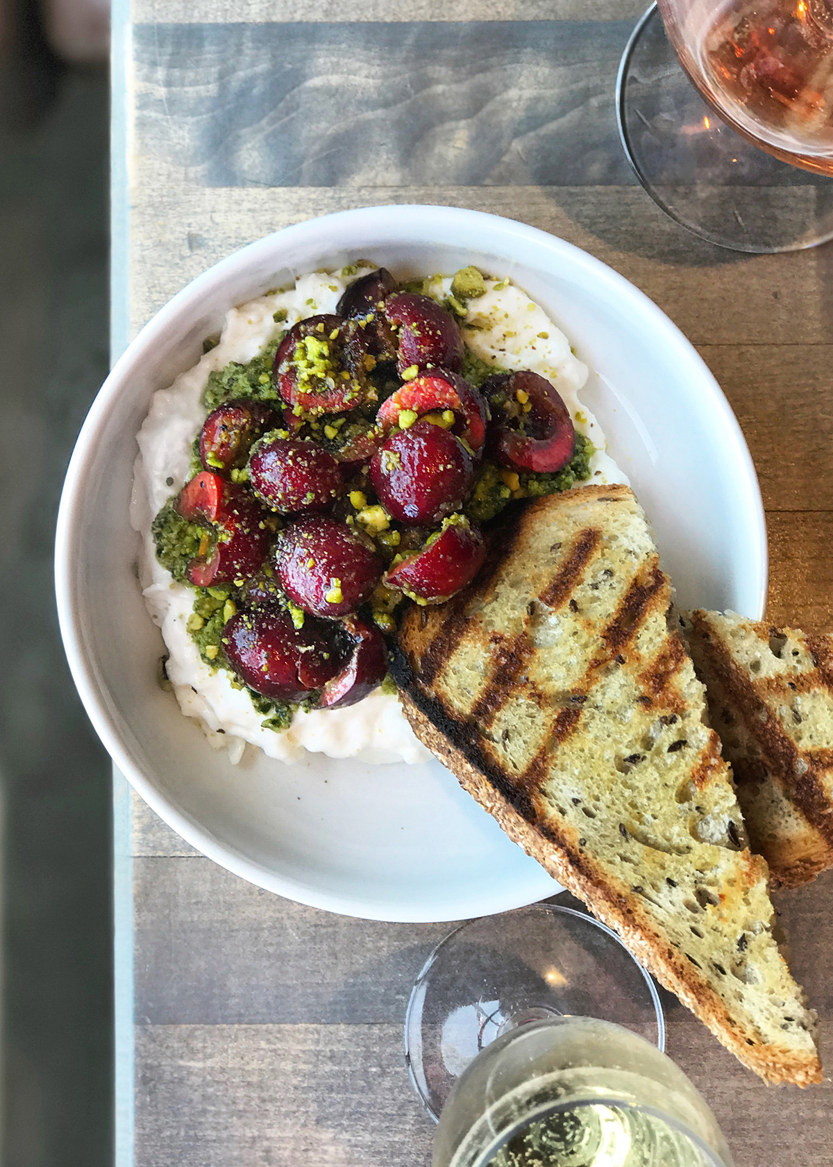 cherries, whipped feta grilled bread