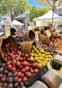 plums and peaches at farmers market