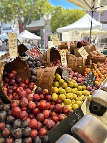 plums and peaches at farmers market