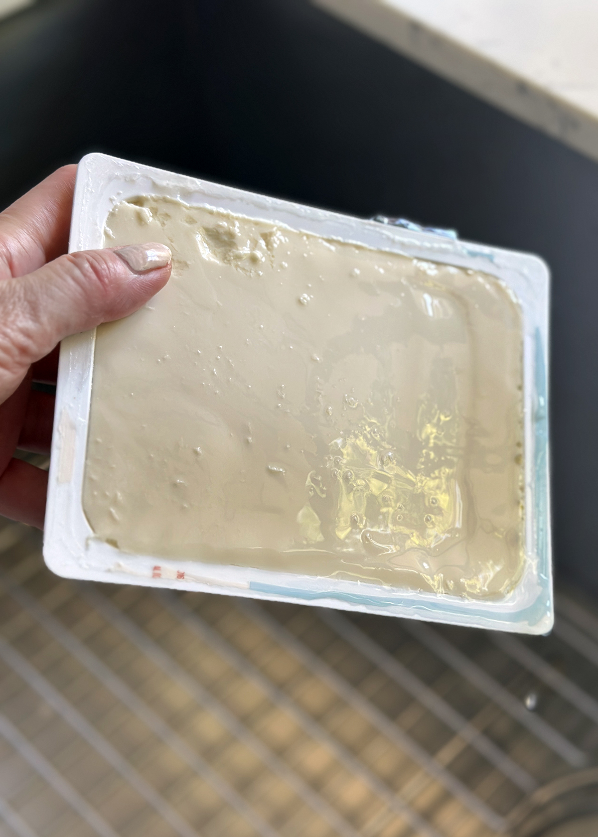 silken tofu draining over sink