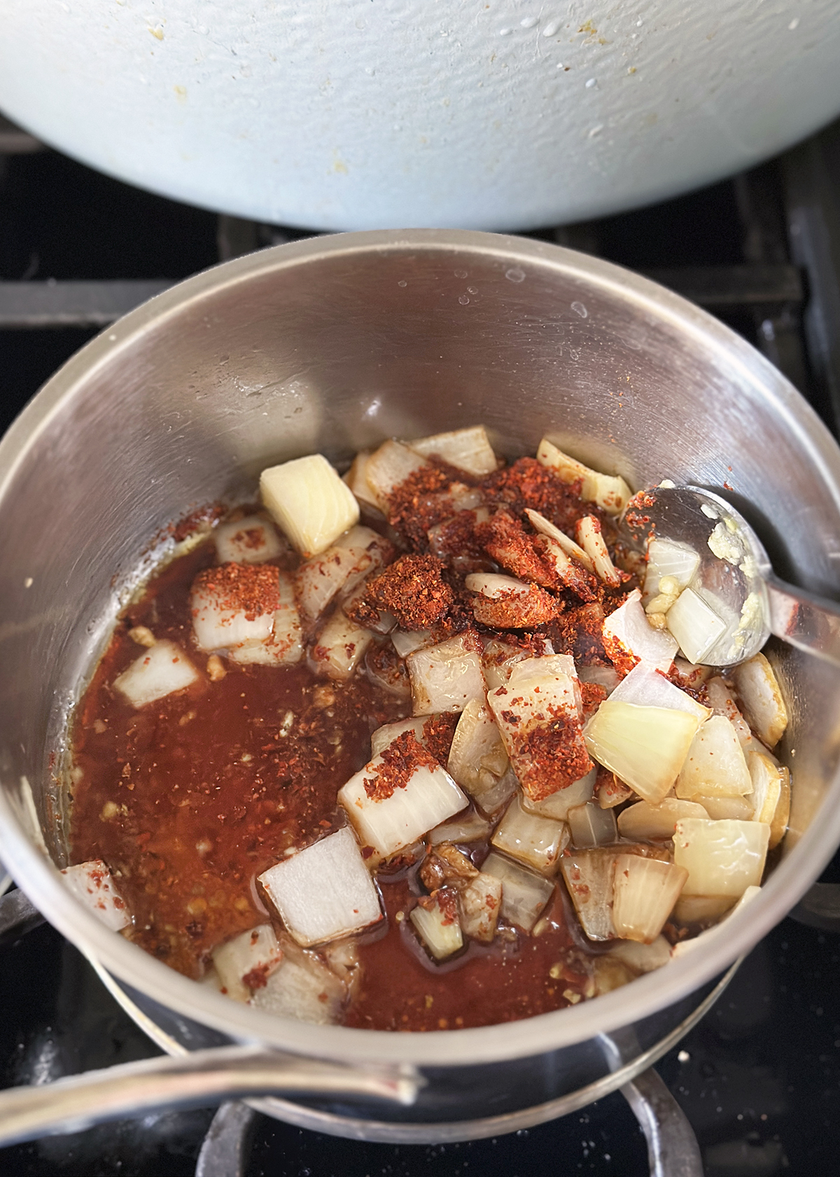 gochugaru and spices added to pot for soon dooboo
