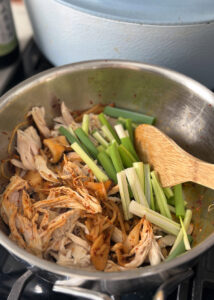shredded chicken and green onions for spicy soup