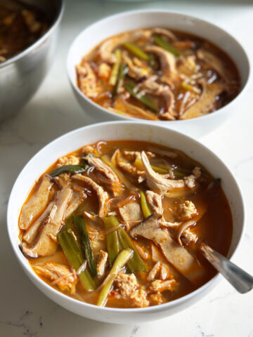 spicy korean chicken soup dak gae jang, in bowls