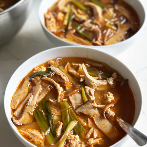 spicy korean chicken soup dak gae jang, in bowls